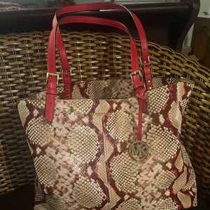 Snakeskin print Michael Kors. Carried less than 5 times-perfect condition.